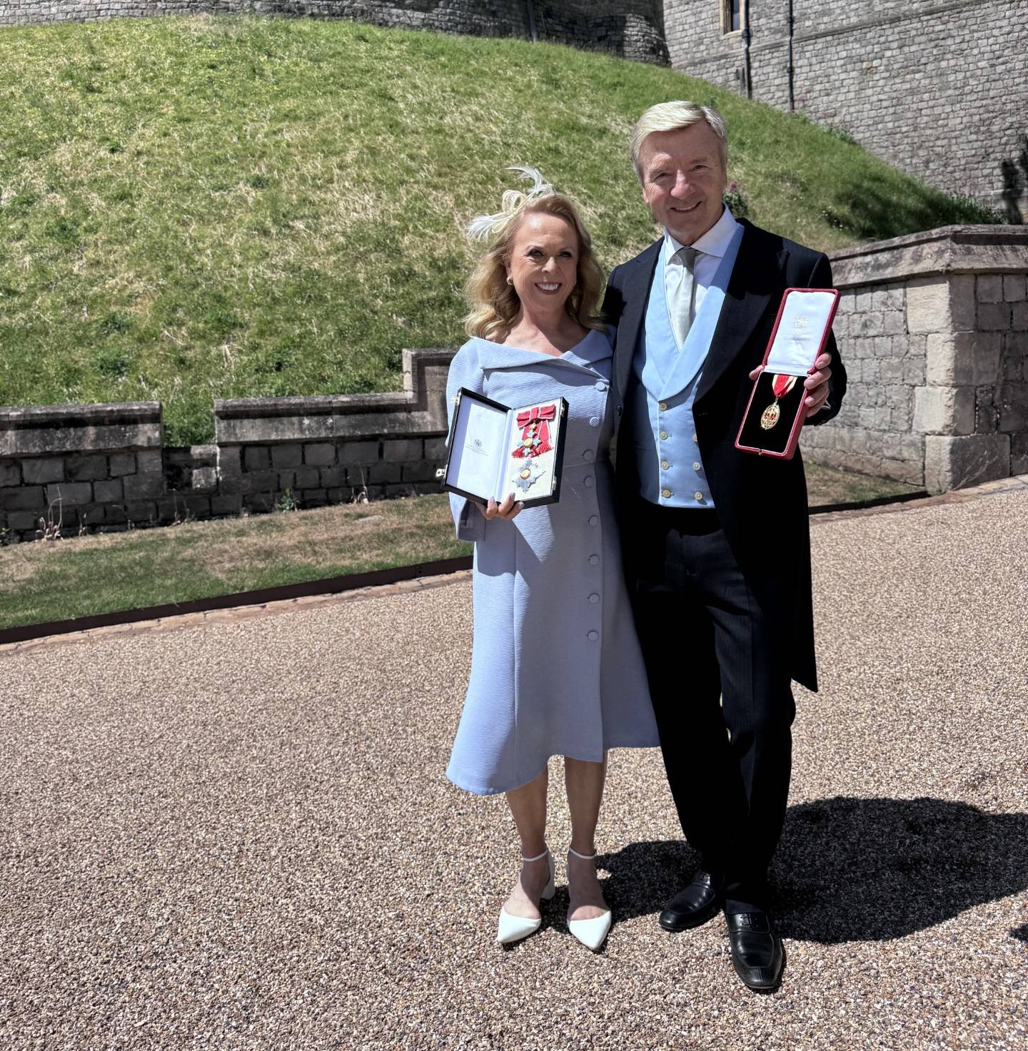 Sir Christopher Dean and Dame Jayne Torvill holding honours at Windsor Castle.